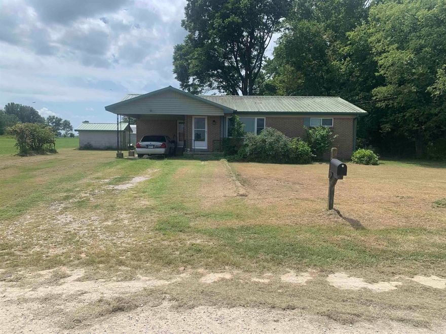 Country living with city utilities! Metal roof and HVAC both installed in 2018. Wall heater provides back up heat in case of winter outages. This 2 bedroom, 2 bath homes sits on a big lot of approximately .65 acres and features a large living area, nice sized kitchen, laundry room, and 2 outdoor storage buildings.