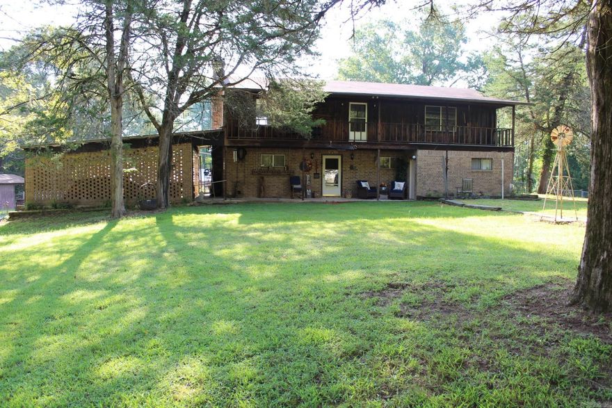 5 bedroom, 3 bath with approx. 3108 Sq. Ft. of living space situated on approx. 54 wooded acres.  Family area features a wood burning fireplace.  Property has several  other structures and a private lake.  Range, microwave, refrigerator and washer/dryer conveys with sell of home.
