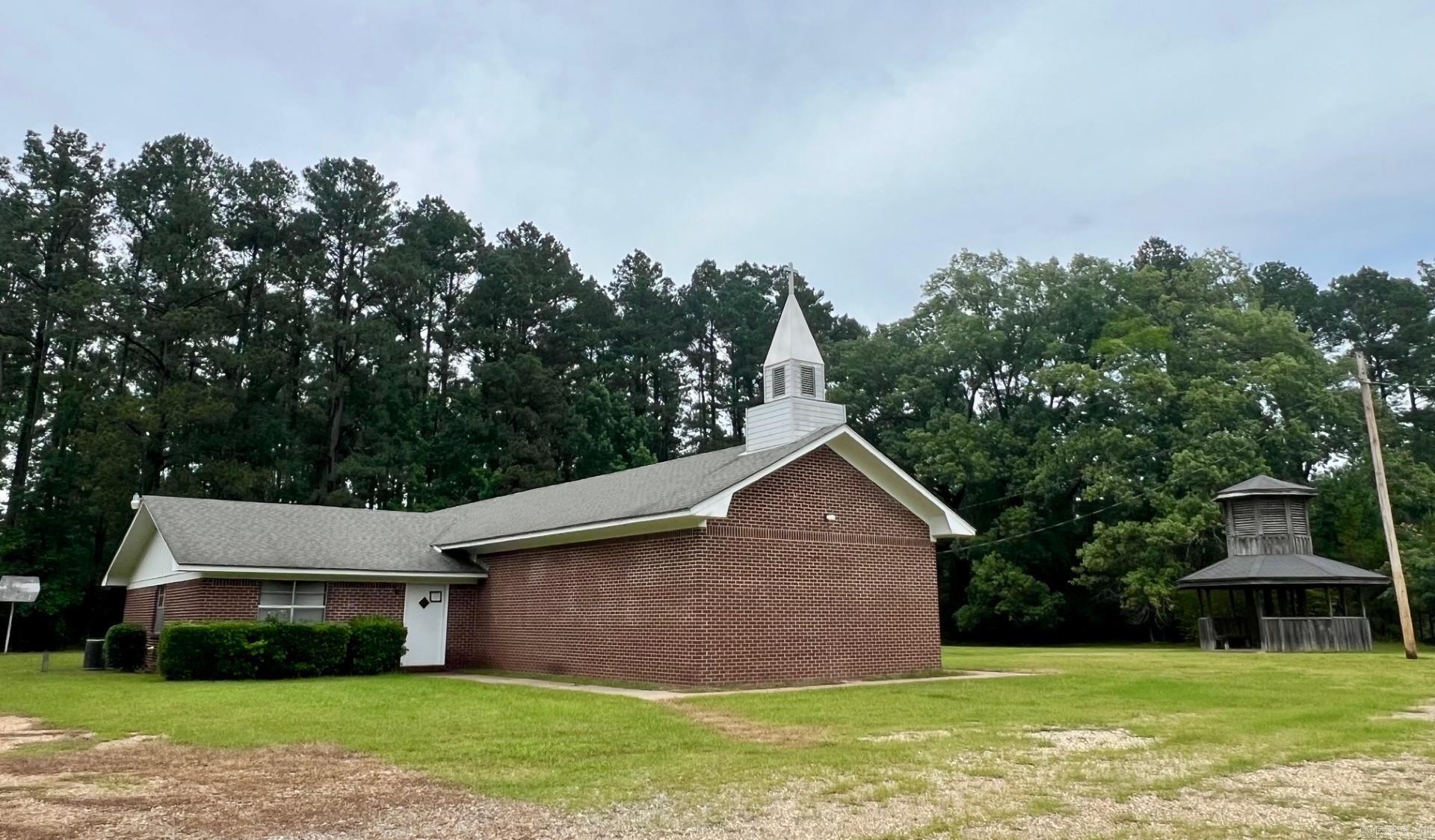 Seller does not limit the uses of the property. Buyer will need to check with county planning and zoning to get approval of uses. Approximate 3000 SF previous church building with sanctuary, fellowship hall, multiple bathrooms, multiple office and classrooms. Two county parcels totaling 3 acres. Drew county parcel # 704-00439-000e and # 704-00443-000e. All showings must be accompanied by a Realtor. NO Disclosures provided by seller. Existing personal property will remain but will not be considered part of the sale. Any items left in the building will be considered as-is and abandoned and will have zero value. Seller makes no guarantees, warranties, or representations of any kind regarding the existence, condition, or usability of said personal property which will remain in building at closing. Title transferred by Special Warranty Deed/Trustee Deed.