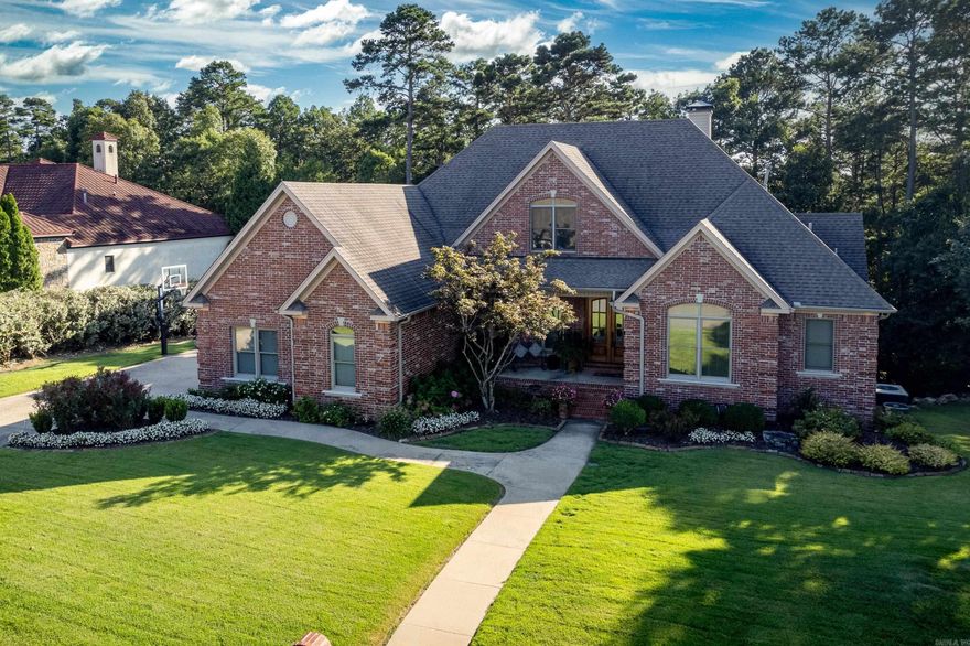 Elegant traditional family home on gorgeous lot backing to mature green-space. Plenty of room in this lovely, updated and newly painted home with three living areas and outdoor entertaining spaces. Coffered ceiling, gas log fireplace and tall windows in great room looking out to vaulted deck with fireplace and built in grill. Vaulted hearth room adjoins the fantastic updated kitchen and breakfast room with Taj Mahal quartzite counters and newer stainless appliances including 5 burner gas cook-top. Huge walk in pantry and plenty of cabinet storage. Spacious primary suite with marvelous bath and closet. Guest suite on main level as well. Upper level has sizeable guest suite with bath and two closets, two guest bedrooms with shared bath and built-in office area. Lower level living area with two more bedrooms, bath and walk out to expansive deck. Three car garage, encapsulated crawlspace and so much more! Come See!