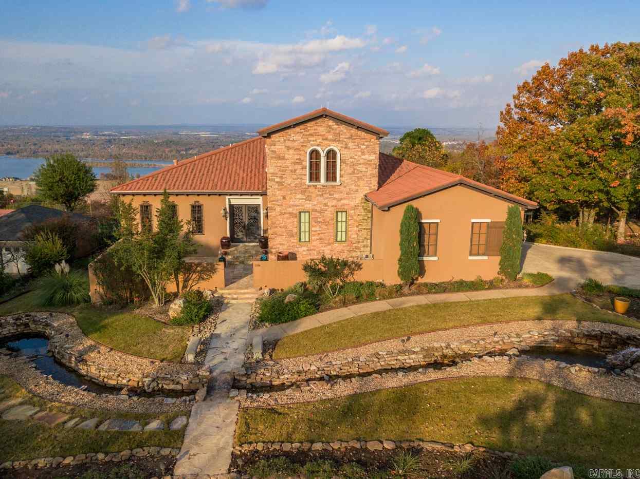 Magnificent Italian villa with stunning RIVER VIEW ! Meticulously Custom built in 2009, everything about this home is like brand-new, inside and out. Main level has formal dining, library, wet bar, "great" great room, fabulous cook's kitchen, all with a view of the Arkansas River. Wonderful master suite w/awesome view. Lower level has 2 very large bedroom suites, safe room. Parking for 5 cars. Not included in living area SF : lower level garage and Safe/Tornado. Both are heated/cooled. Rare opportunity