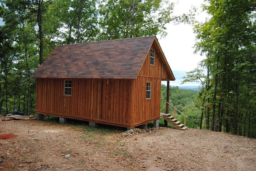 A BRAND NEW UNFINISHED CABIN SITTING ON 14 ACRES WITH A YEAR ROUND SPRING, HAS RURAL WATER , ELECTRIC AND A SEPTIC, YOU CAN FINISHED THE INSIDE THE WAY YOU WANT, ROOM TO BUILD ON IF YOU WANT IT BIGGER, HAS A REALLY NICE VIEW OF THE MOUNTAINS, NEAR THE BUFFALO NATIONAL RIVER AND LOADS OF THING TO DO, BEING ON A GRAVEL ROAD, YOU CAN RIDE YOUR HORSES TO THE CREEK AND THE RIVER, LOTS OF HORSES TRAILS IN AREA. NEAT AREA, NOT A LOT OF DIRT ROAD,