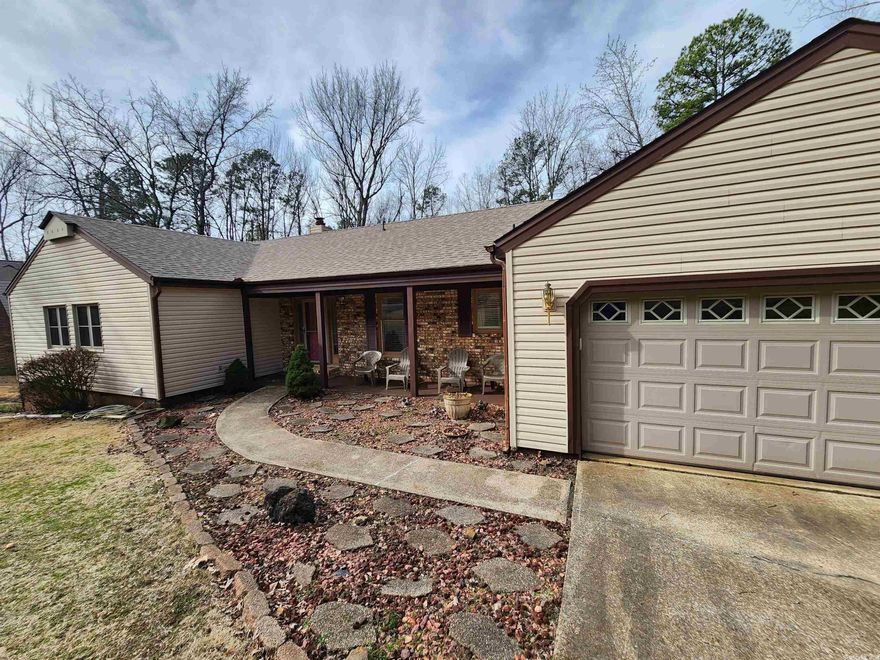 This original showcase home for Fairfield Bay offers a large tile & glass walk in shower, his & her sink. Open floor plan, stainless appliances,  shop outback, heated & cooled sun room, extra parking, beautiful landscape and babbling creeks out back.  Enjoy the  approx 100 miles of atv, sxs, hiking, biking and outdoor trails, the 3 outdoor pools, 10% off at anything the FFB resort owns (some exceptions) and more all for the $155 a month. Approx $55 is the real dues but they also collect the sewer and trash same time. That's why we show its approx $155 monthly.  Not to bad for $55 a month, 3 pools & approx 100 miles of trails! Leave your home on a sxs, grab some gas at local stations, hit the trails, stop by local marina to check on your boat at one of the 125 plus slips available for monthly rental & stop for dinner at one of the local restaurants and stores before returning,  while never leaving your sxs, atv or however you decide to go! Where else can you find all this?  Call an agent today for more info! Don't forget to join 1 or both of the well maintained Golf Course too!