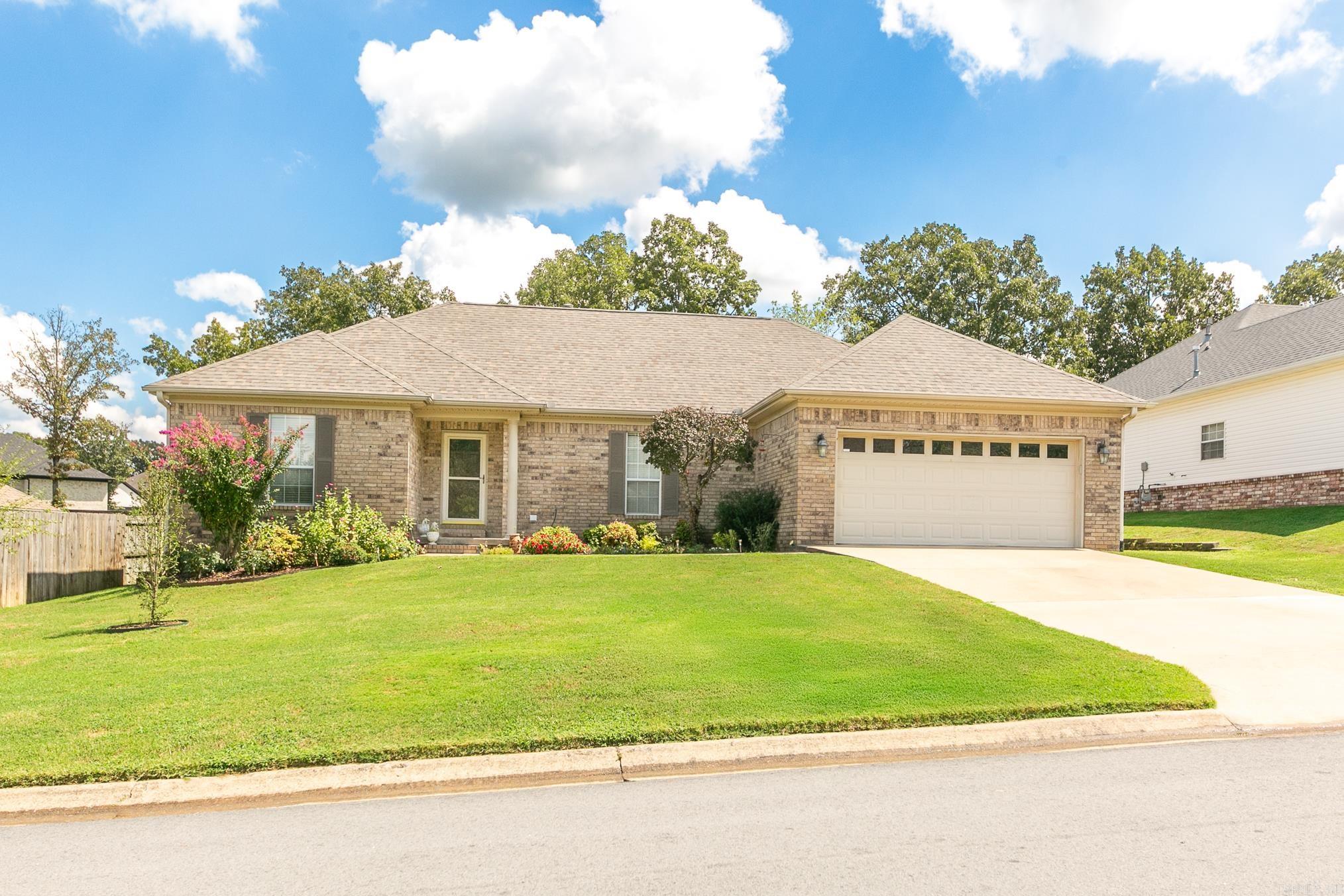 Welcome to 4001 Austin Lakes Circle, a charming and updated home located in the desirable community of Sherwood, Arkansas. This meticulously maintained residence features three bedrooms, two bathrooms, and an open floor plan all centered around a 3-sided fireplace. At the heart of the home lies a large, open kitchen with ample counter space and storage, upgraded in 2022 with new granite countertops, a modern sink, faucet, garbage disposal, and oven. Other updates include: New water heater 2018, New HVAC 2021, Lift Master Garage Door opener 2022. New Deck and toilets in 2023. New Dishwasher in 2024. New Roof in 2025. The property also features a French drain system in the backyard. The sunroom is perfect for relaxing. Step outside to the spacious deck and admire the manicured and fenced backyard. Ideally located just 2 miles from the interstate this home has quick access to restaurants, shopping, and services. 4001 Austin Lakes Circle is more than just a house... It's a place to call HOME.