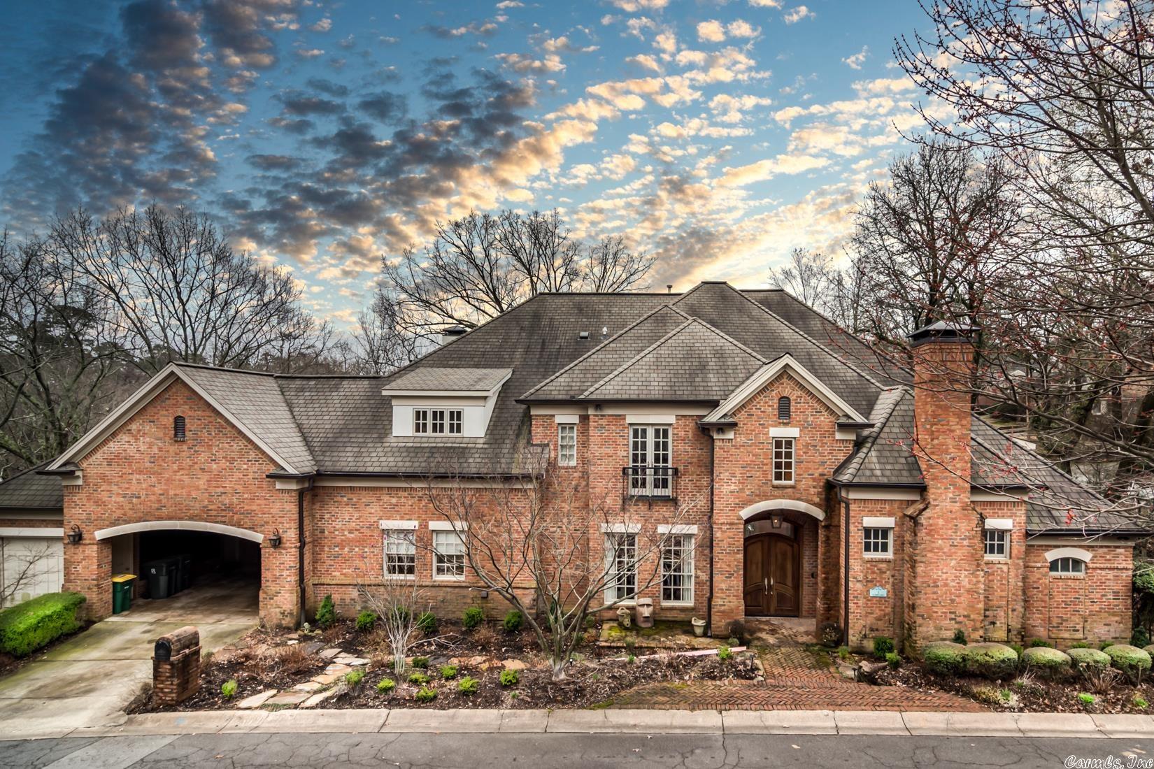 Entertainer's Paradise. This stately traditional Heights home, custom built in 2009, offers 3 Levels of abundant living. The house measures at 6,000 square feet with 4,816 square feet above grade and 1184 square feet below grade. The main level includes the ensuite primary bedroom with his and her closets and heated floors in the bathroom. Large great room w/ wall of windows overlooking beautiful wooded vista and rambling creek. Stainless steel appliances throughout kitchen including a brand new wine refrigerator and spacious butler's pantry. Home office and formal dining room located at the front of the home. Upstairs offers 3 large ensuite bedrooms and open living space. Lower level offers 1000 square feet of heated and cooled space including a full size bathroom. Large covered deck with new railings, mounted heaters and television overlooking creek. 1 car carport with a golf cart garage.