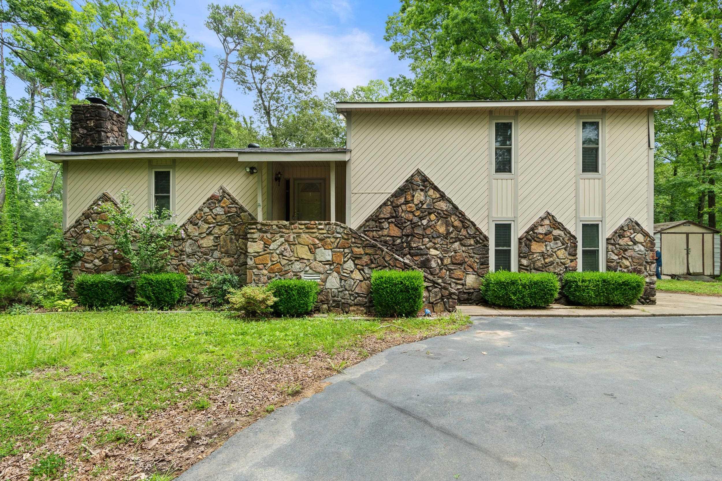 Welcome to 15919 Bluff Ln in Mabelvale! This charming 4-bed, 2-bath tri-level home sits on a peaceful 2.25-acre lot and offers 1,940 sq ft of flexible living space. The main level features an open-concept living and dining area with a cozy rock fireplace, while the kitchen includes ample cabinetry and essential appliances. Upstairs, youāll find three bedrooms and a full bath. Downstairs offers a spacious bonus room that can serve as a fourth bedroom, game room, or office, plus an extra flex space for storage or hobbies. Built in 1978, this home features central electric HVAC and plenty of parking. Located in Ramble Estates East, it combines the serenity of country living with convenient access to city amenities. If youāre looking for space, comfort, and flexibility, this home has it all!