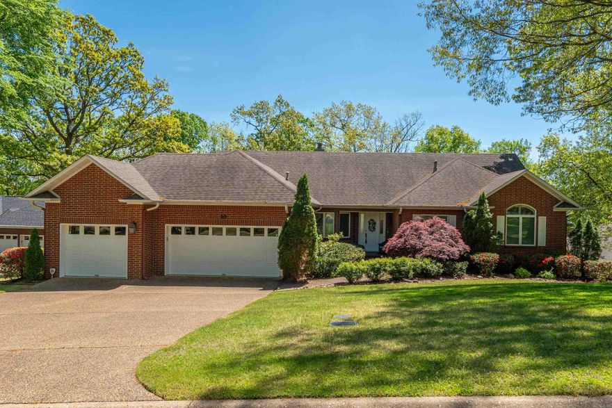Don't miss this Lake Hamilton waterfront home in the gated Stonegate Shores community offering wide channel views and approximately 4,529 square feet of living space. This six-bedroom, four-bath residence features multiple living areas designed for gathering and entertaining, along with expansive decks and patios that extend the living space outdoors.  The main level includes open living areas, a kitchen with quartz countertops, breakfast bar, and eat-in dining area, along with a hearth room and spacious great room with lake views. The primary suite offers a large bath with heated floors, dual vanities, walk-in shower, and walk-in closet.  The lower level provides excellent guest accommodations with three bedrooms, two baths, and generous recreation space including a large living area, game room, and theater area, with walk-out access to the outdoor entertaining spaces.  The landscaped lakefront lot leads to a covered boat dock with lift and swim platform. Stonegate Shores offers gated access along with neighborhood amenities including a swimming pool and tennis courts. Convenient access by land and water to nearby restaurants and marinas.
