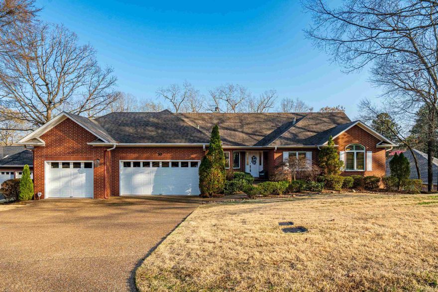 Don't miss this Lake Hamilton waterfront home in the gated Stonegate Shores community offering wide channel views and approximately 4,529 square feet of living space. This six-bedroom, four-bath residence features multiple living areas designed for gathering and entertaining, along with expansive decks and patios that extend the living space outdoors.  The main level includes open living areas, a kitchen with quartz countertops, breakfast bar, and eat-in dining area, along with a hearth room and spacious great room with lake views. The primary suite offers a large bath with heated floors, dual vanities, walk-in shower, and walk-in closet.  The lower level provides excellent guest accommodations with three bedrooms, two baths, and generous recreation space including a large living area, game room, and theater area, with walk-out access to the outdoor entertaining spaces.  The landscaped lakefront lot leads to a covered boat dock with lift and swim platform. Stonegate Shores offers gated access along with neighborhood amenities including a swimming pool and tennis courts. Convenient access by land and water to nearby restaurants and marinas.