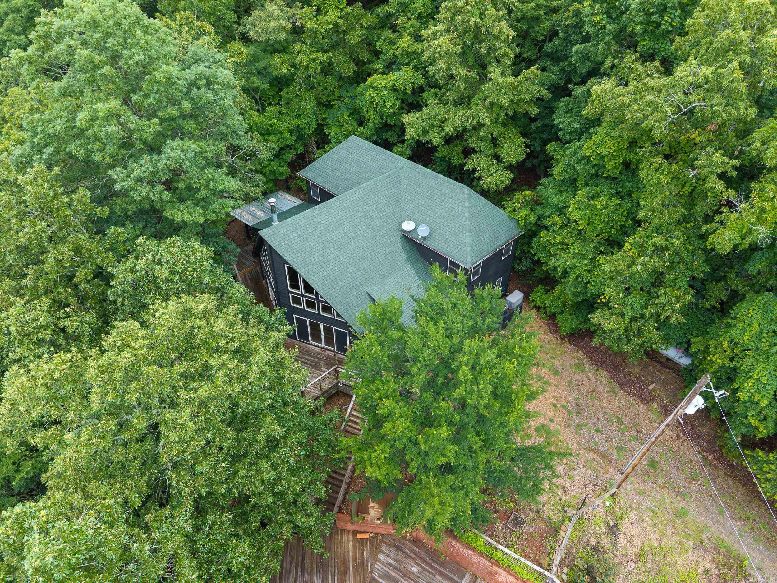 This property features 382+/- acres with a combination of wooded and roughly 90 acres of pasture land. Parts of the wooded acreage is ready for harvest while you are free to run livestock on the abundant pasture land that includes multiple water sources including Cedar Creek. The primary house is a two level, 3 bed/2 bath home with a safe room, backup generator, stainless steel appliances & more. This home includes outdoor patio spaces, an outdoor sink and grill &above ground pool. This farm also features an 800 sq.ft. hunting cabin, a 1600 sq. ft. pole barn and 2 large utility buildings. Priced below appraisal, this property is ready for your new homestead. Currently an active gas well on the property that does produce royalties.