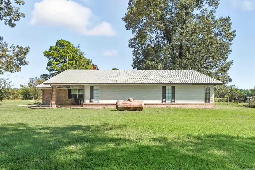 If you're looking for a nice, secluded home this is it. Spacious 4-bedroom 3 bath home with 2936 sq ft of living space.  This property has 10.2 acres of fenced pastureland, a storm shelter and a greenhouse.  Everything you need for a small family farm!