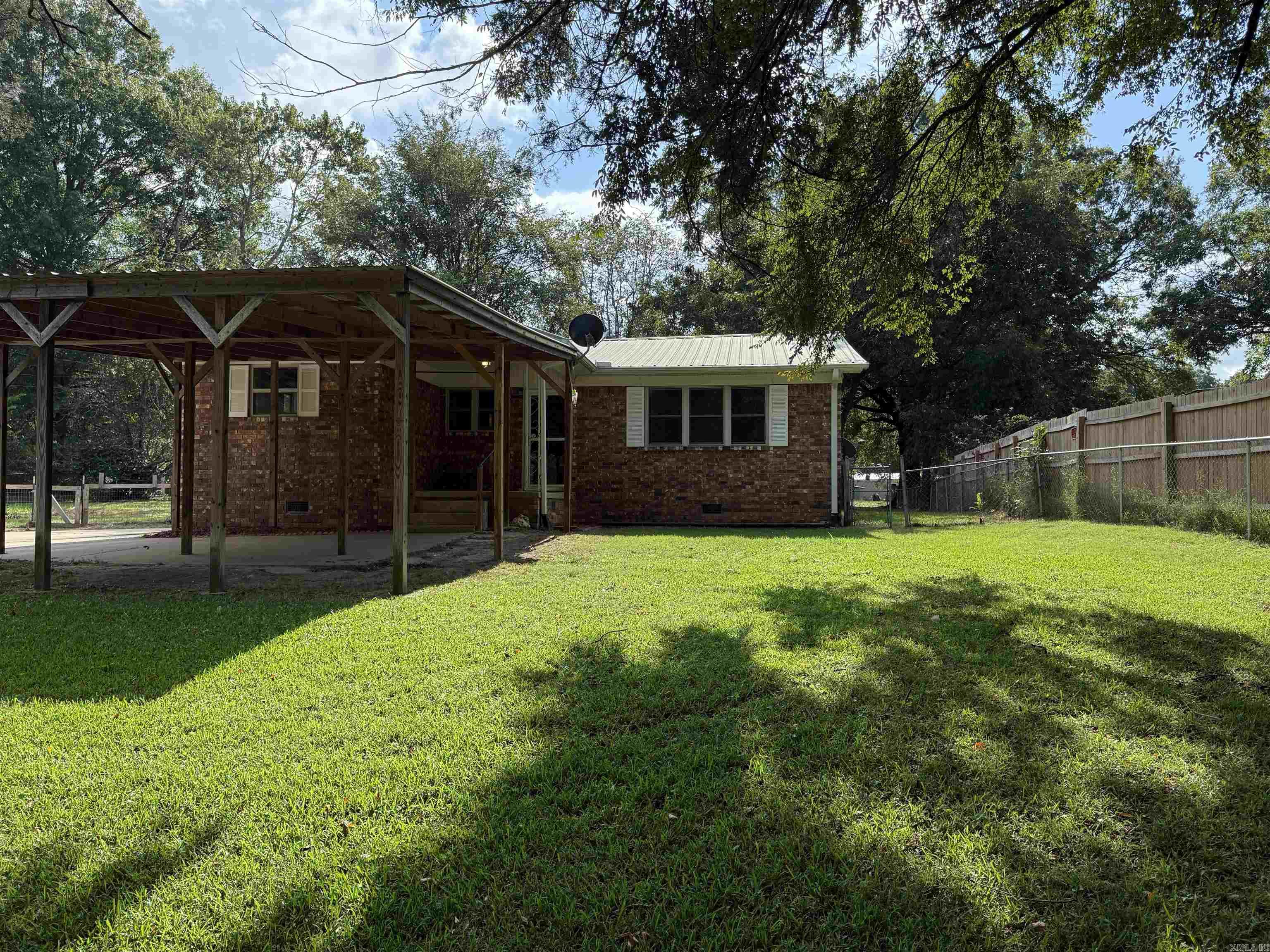 Have you always wanted to live close to a river? Now, you can! Completely remodeled brick home with a metal roof and three year old HVAC, conveniently located across from the Little Red River boat landing, offers a perfect blend of comfort and functionality. Step inside to an open-concept kitchen, dining, and living area featuring durable laminate flooring, making it an ideal space for entertaining and everyday living. The home boasts two generously sized bedrooms, with a third room currently utilized as a laundry space, providing versatility for your needs. Outside, you'll find a shop, complete with a separate storage room, perfect for all your hobbies and projects. The property features a fenced-in backyard that extends all the way to the back street, offering privacy and ample outdoor space. A carport and front porch enhance the home's curb appeal, making it a welcoming entryway. Situated just a short drive from Searcy and approximately 11 miles from the White River boat landing, this peaceful place is an inviting retreat for those who appreciate both nature and convenience. Donāt miss the opportunity to make this home your own! Call for an appointment today! This one won't last
