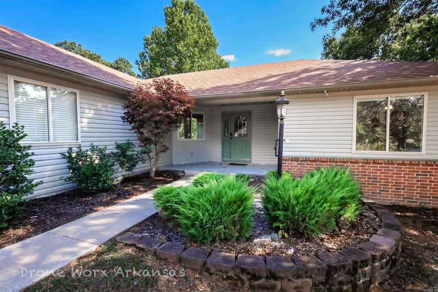 Welcome home to 9 Piccadilly Lane! Tucked away on a peaceful cul-de-sac in Bella Vista’s Primrose subdivision, this 3-bedroom, 2-bath home is designed for comfort and everyday living. The spacious living and dining areas flow easily into the kitchen, truly the heart of the home and perfect for gathering with family and friends. A split floor plan offers added privacy, with the primary suite featuring a walk-in closet and a spa-like bathroom with a walk-in shower and jetted tub—perfect for unwinding at the end of the day. A carpet allowance for the bedrooms gives you the chance to make it truly your own. Step outside to a large deck and patio with wooded views and a spot ready for a hot tub—ideal for cozy evenings or entertaining guests. Recent updates to the roof, HVAC, and kitchen appliances add peace of mind, while the two-car garage provides plenty of storage for mountain bikes and outdoor gear. A wonderful place to call home in beautiful Bella Vista!