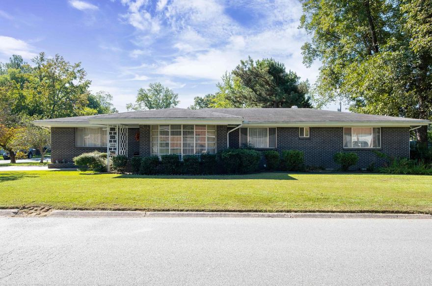 Beautiful Brick Home offering space for everyone in Mid-Century Design. This one level home features 3 BR/2BA, Living Room/Dining Combination, Kitchen/Den Combination w/Breakfast Bar, Family Den w/Fireplace and Wet Bar.  Home is carpeted, but original hardwoods are under the carpet ready to be restored.  Primary BR has Bath w/Walk In Shower and Walk In Closet.  Hall Bath offers Tub/Shower Comb.  Lots of Closet storage, and out in the Family Den is a walk-in Cedar Closet for Off-Season clothes and an optional 1/2 Bath.  Laundry Room off Garage.  Fully Fenced Back Yard.  Refrigerator and Washer/Dryer all convey with the right price.  This Mid-Century Classic Home is ready for a new family.