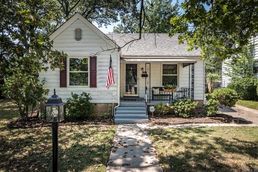 Come see this darling, classic bungalow. With original hardwood flooring, the residence boasts a charming front porch and a spacious patio, perfect for unwinding. Enjoy the natural light streaming through the new vinyl windows. The kitchen is complete with essential appliances: built in range, microwave, dishwasher and refrigerator. The full size Kenmore washer/dryer convey. The primary bedroom has two closets. The back room features new carpet, allowing for use as a bedroom, office, or 2nd living area. With a rebuilt carport, new sewer line, new vinyl windows, new retaining wall, a 2019 roof and vapor barrier in the crawlspace a lot of the big ticket items are done! The SimpliSafe security system provides added reassurance and conveys. Walk to UAMS! This house is move-in ready or you can add your own touches!