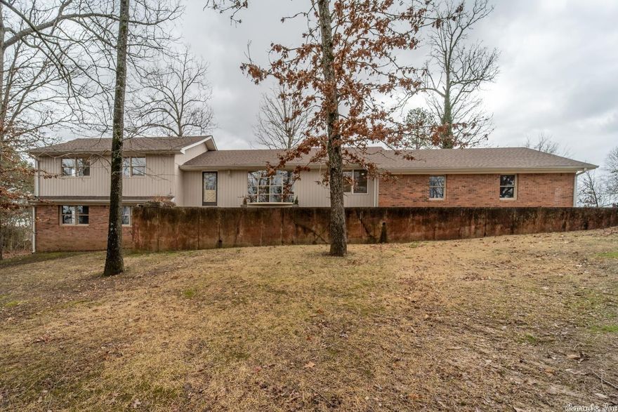 OZARKS IN TOWN HOME FOR SALE SALEM ARKANSAS Property is located at 289 Circle High Dr., Salem, AR. This spacious home has 5 bedrooms, 3 baths with over 3,650 sq. ft. of living area which includes the finished walkout basement. The interior of the home has been completely remodeled. The main level includes 3 bedrooms and 2 baths. It includes new hardwood flooring, carpet and tile flooring, paint, new kitchen appliances, kitchen cabinets.  It has 2 central heat and air units. Formal living and dining room with large family room. Spacious kitchen area with the new appliances and cabinets. The downstairs has large man cave/family room for your family or group get togethers. Also includes 2 bedrooms, 1 bath and plenty of storage area. Brick and siding home located on 2 shaded lots with large oak trees in nice neighborhood.  2 car garage with concrete driveway and large parking pad. Fenced in back yard with large wood deck to enjoy your cookouts. New roof recently installed. Lake Norfork, Spring River and the world famous White River are within 30-45 minutes of the property.