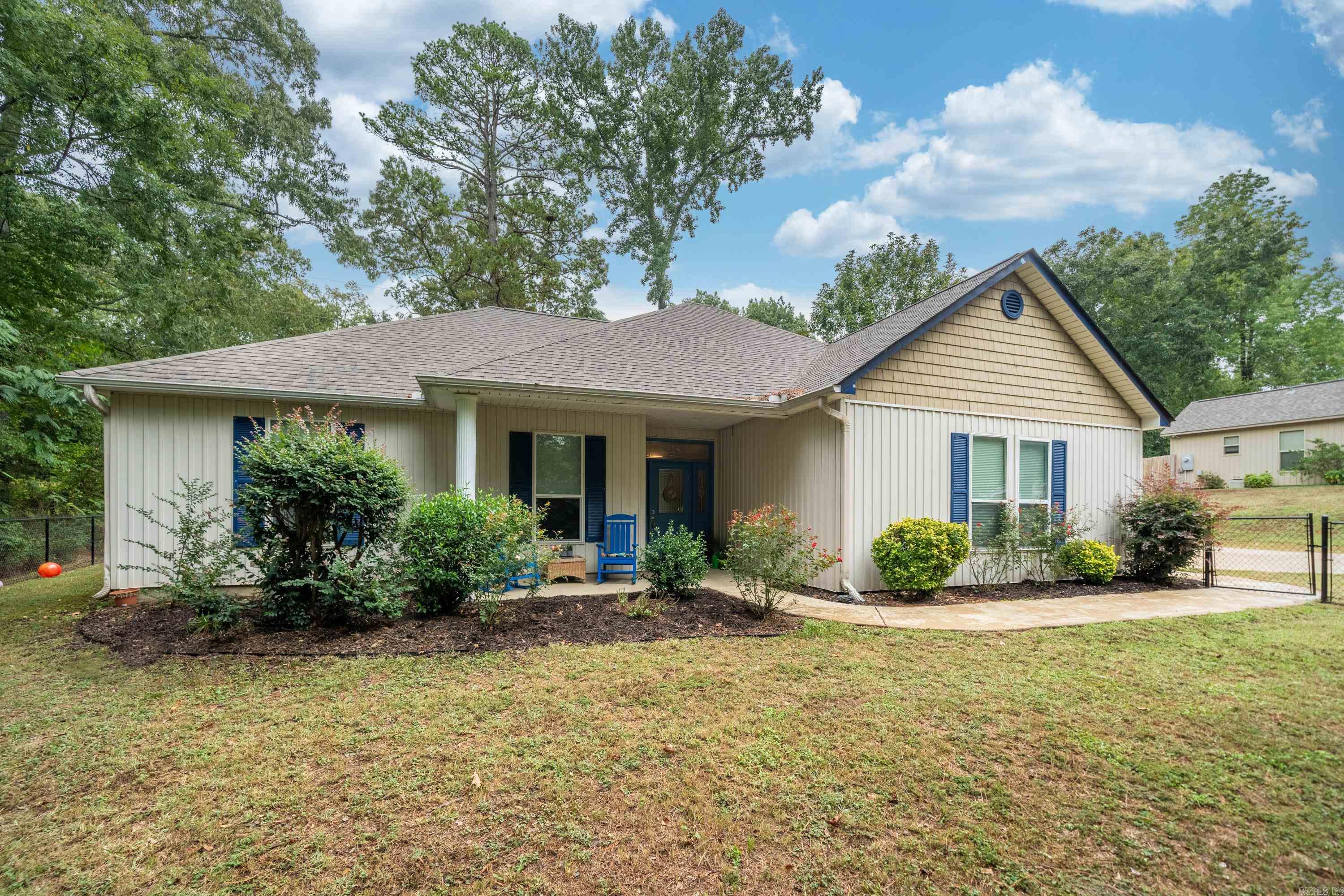 Offered by Lake Hamilton Realty, Inc--Lovely, Secluded Home with All Electric Modern, Updates and is only 1 Block from Lake Hamilton--New Luxury Vinyl in Primary BR 2023, New with Remote Window Blinds--New Tile in 2022, New Carpet in 2021, Water Heater in 2022--New Lighting, Smart Thermostat, Patio Fans w/ remotes on Patio have All been added--All appliances convey except Trash Compactor & Fridge--Washer/ Dryer Convey--Gutters installed front & Back--Rust Free Front and Back Fence--Crown Molding and Interior Paint...Beautiful, Immaculate Home!!!