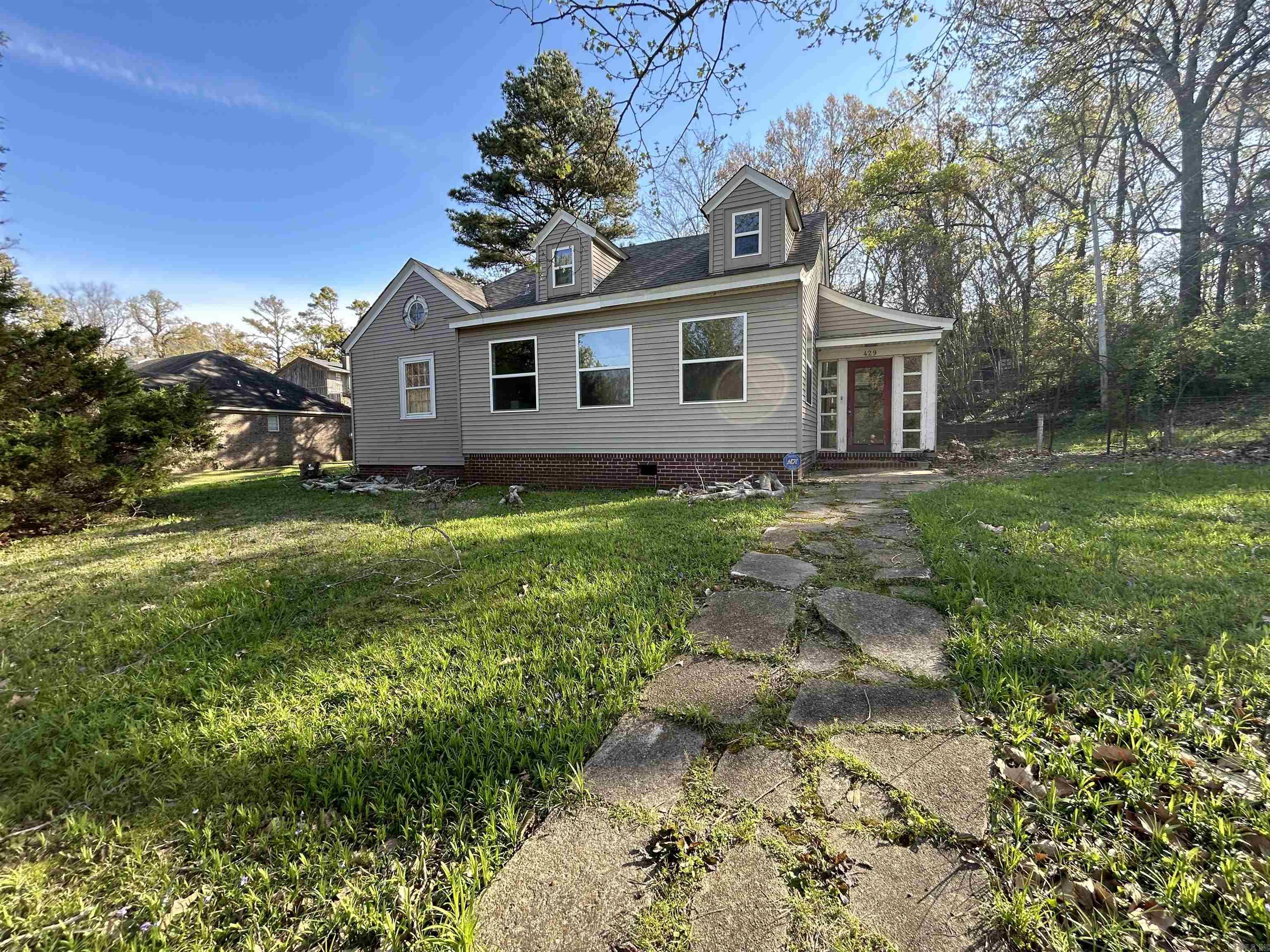 Check out this great home in Forrest City! This home features three bedrooms, three full bathrooms, formal dining room, large kitchen, and a spacious living area.