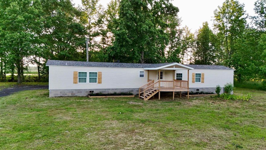 Enjoy living out in the country? Well check out this renovated manufactured home on 3 acres of FLAT LAND! This move-in ready home has 3 bedrooms and 2 baths, an open concept design features a layout where the living, dining, and kitchen areas are interconnected, allowing for greater flexibility and a more spacious feel. Fresh paint and new vinyl flooring throughout the house. Updated bathrooms with beautiful tiles! New deck to relax and enjoy your yard! Please schedule your showing now!