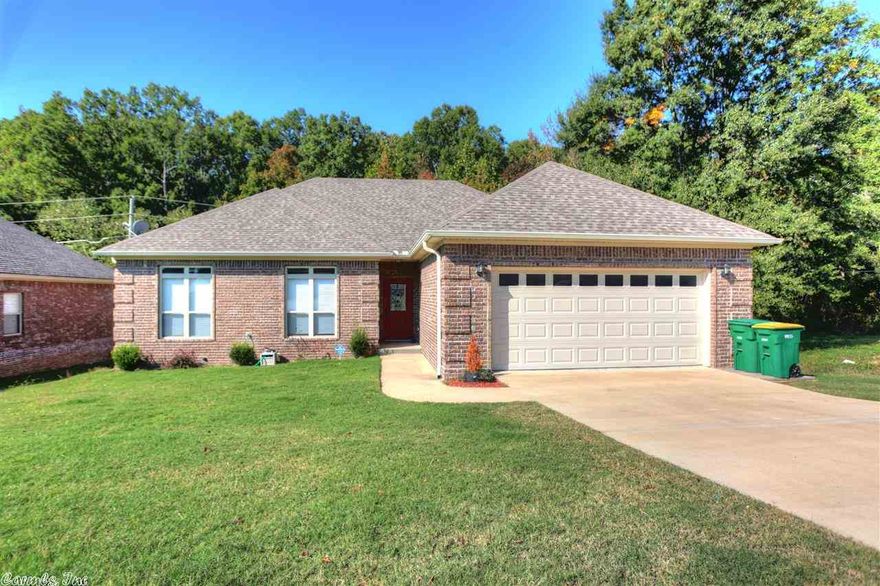 COMMUNITY OWNERSHIP WITH PRIVACY AND GREEN SPACE INCLUDING FULLY FENCED BACKYARD, ORIGINAL OWNER! Open floor plan to kitchen, great room and dining area!  Attractive 3 bedroom, 2 bathrooms, hardwoods throughout, high ceilings, kitchen has granite counter tops, stainless steel oversized refrigerator/freezer conveys with home, beautiful porcelain tiles, abundant cabinet space in kitchen.Home has covered porch great for entertaining! Great Location only minutes from LRAC...Built in 2010..Move in condition...