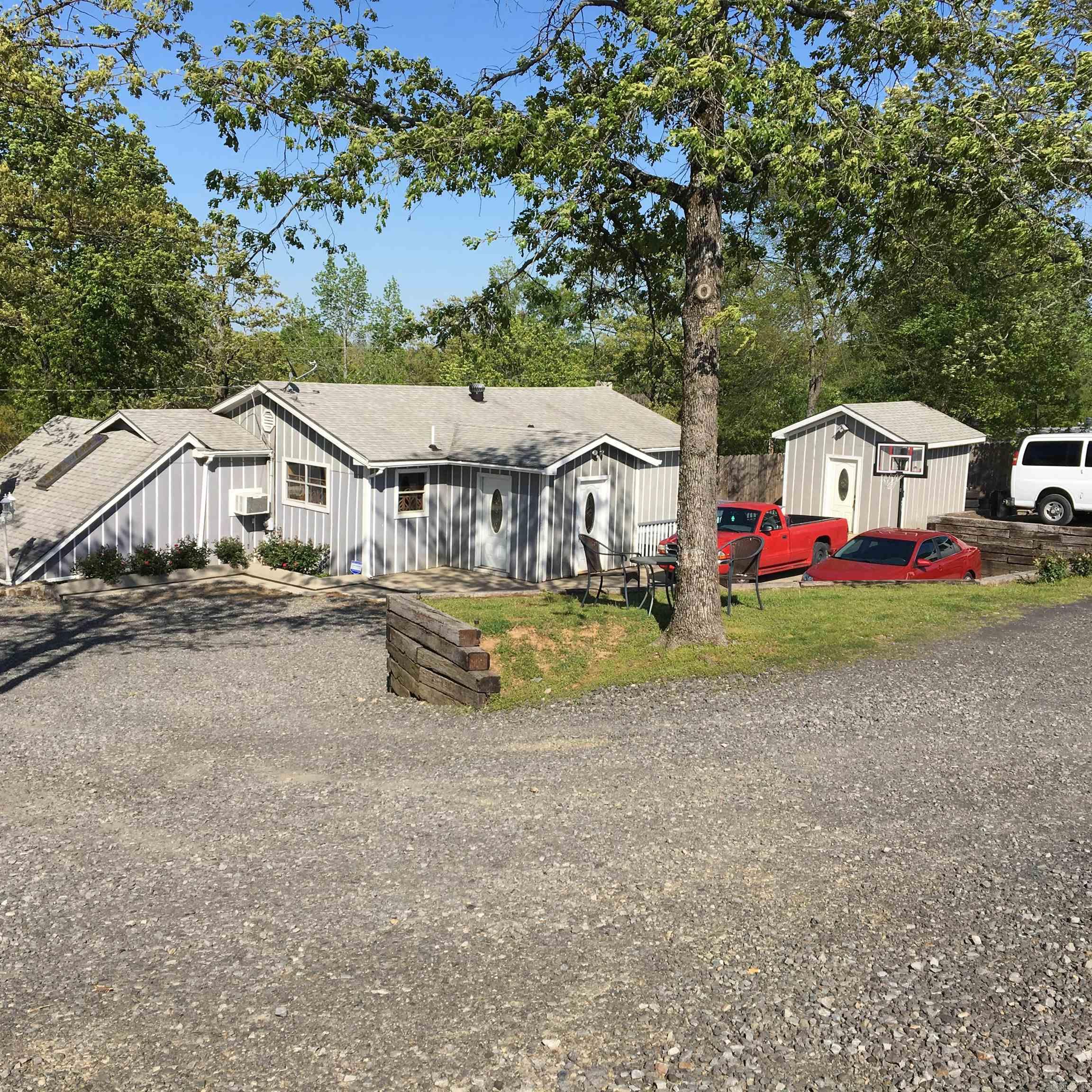 Looking for a prime spot to call home and have commercial visibility? This is the place you've been looking for! This hilltop has huge potential with its 17,000 daily car count exposure, giving any business the upper edge! Currently has house and a separate office on the highway that was operating as a car lot. Not only that, there is a fully functioning kitchen and pavilion if looking for a restaurant start up. There is also a slab poured for a building to be placed on that could be whatever you choose. Right at 2.5 acres, so plenty of room to expand... This is not in the city limits which gives flexibility for whatever you choose to do. The footprint is set, looking for someone to step into it! Book your showing today to check out this rare opportunity that doesn't come around often!