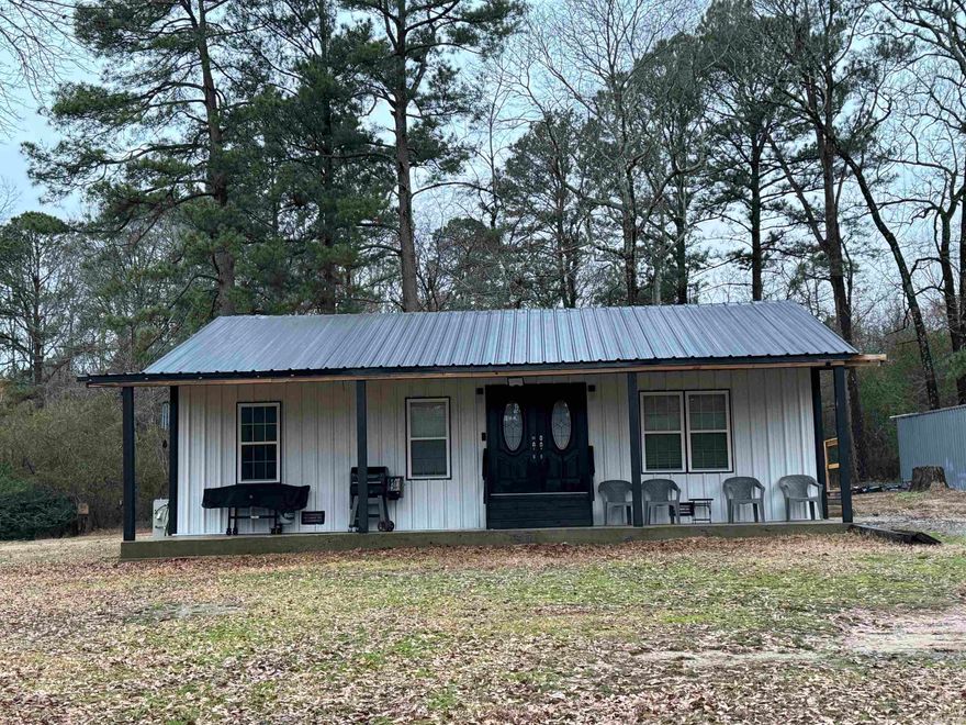 Recently remodeled gem offers the perfect blend of modern comfort and rustic charm. 3 bed 2 bath with a flex room, can be additional bed room, movie room, office, options are endless. Enjoy a nice night on the 40 foot covered porch.  Bryant School District, bus picks up at driveway. 26' round above-ground pool with deck, perfect for summer relaxation. 20 X 22-foot shop with concrete floor and power for your hobbies or additional storage. 40-foot conex for even more storage space. Conveniently located within 15 minutes of Bryant or the Outlets. New septic system in 2018; New HVAC 2018 ; New Roof 2022; New hot water heater 2020. 2 Refrigerators, kitchen table, washer & dryer, master TV, electric fireplace, swing set & trampoline all convey with property.