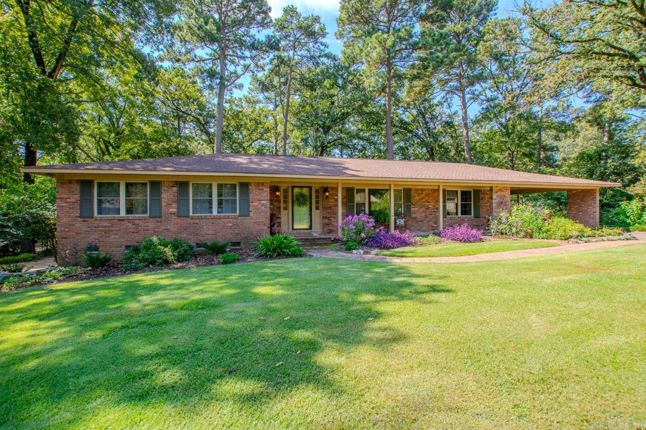 1965 With original hardwood floors, updates with 1960's charm. Three large bedrooms and 2 full baths. Kitchen with stainless steel appliances and granite counter tops, lower cabinets with pull outs for easy access. Laundry room is large with abundance of storage and can be used as a pantry. Roof 2019, Water Heater 2024, Kitchen updates 2015, bath updates 2022. Storage room off double carport is heated & cooled but not included in square footage.Beautiful home in one of Benton's oldest and lovely neighborhoods! Call listing agent to Make an appt today!