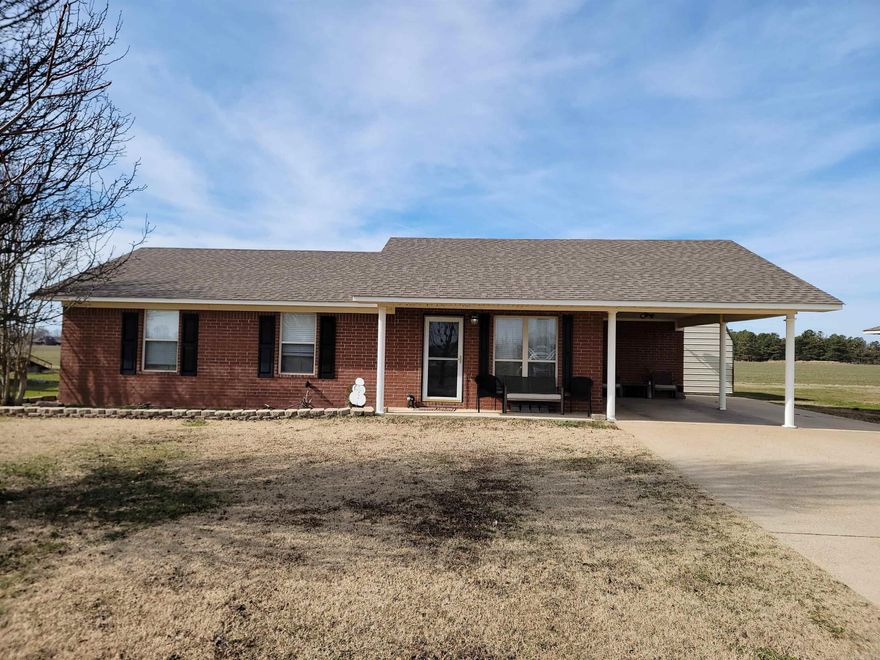 Super cute! Super clean! If you want 'NOT in the middle of town' ...take a look. Perfect for a first-timer or down sizer. 3 bedrooms, 2 baths with a large laundry room with a ton of new shelving! The carport is deep and there is a turn around pad so you can pull out forward. Current owners have updated paint, flooring, light fixtures, hardware, shutters had a BEAUTIFUL beam installed in the living area among other things. They have truly transformed it into a real beauty. Don't waste time- schedule a tour today. Seller will pay $4,000 in closing costs for the buyer.