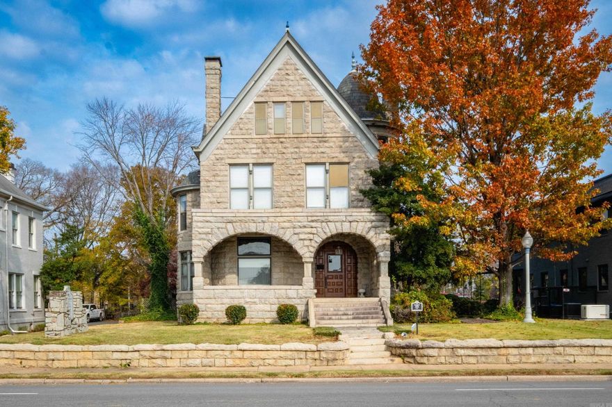 The stunning Solomon Gans House is a historic building in Little Rock.  It is a  2 1/2 story masonry structure built out of rusticated granite.  Its front is dominated by a two-arched porch, and there is a turret with a bell-shaped roof on the right side.  Built in 1896, it is the only known local residence to be built in the Romanesque Revival style and is on the U.S. National Register of Historic Places.  There are ten offices in the building with an unfinished basement that could provide three more.  It has a conference room that is set up for zoom meetings and an additional conference room that serves as a law library.  The two story Carriage House is located behind the house and includes an upstairs living area, bedroom, bath and kitchen.  More office space is available downstairs.  The property also includes a parking lot at the corner of W 2nd and Chester.  Purchase of office furniture is negotiable.