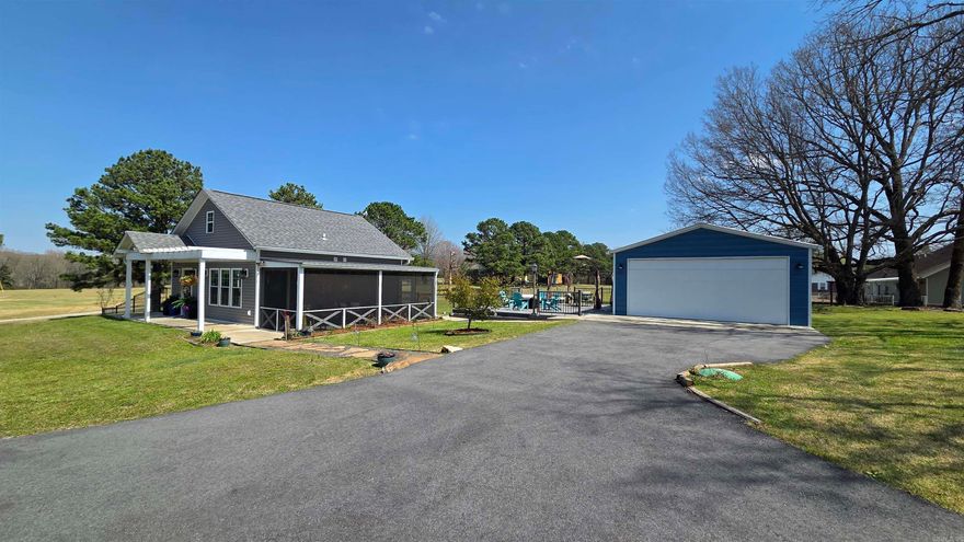 Luxury Meets Efficiency in These Two Beautifully Designed Smart Tiny Homes! 1st Built in 2021, features a 2-bedroom, 1-bath open floor plan with tall vaulted ceilings, quartz countertops, smart stainless kitchen appliances, tile shower, stove, washer and dryer, built-in wine rack, island, fireplace, tankless water heater, LED lighting, black chain-link fence, Trex decking for the patio to enjoy the hot tub and entertaining area, plus a screened-in porch and paved driveway. Both homes sit unrestricted on a perfectly positioned 1.63 acres directly across from the Riverland Golf Course, with no HOA fees. 2nd addition in 2023 is a guest or mother in law quarters includes, quartz countertops, fireplace, stainless kitchen appliances, concrete sidewalks, raised garden beds, private drive, tiled shower, LED lighting throughout, and an expanded entertaining area with soft lighting and a porch swing—perfect for entertaining or relaxing. Both properties are offered as turn-key, ready for immediate enjoyment—ideal as a full-time residence, weekend retreat, or short-term investment opportunity.