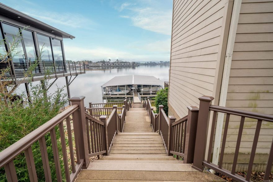 Embrace lakeside serenity in this beautifully renovated 3-bedroom, 2.5-bathroom Hot Springs condominium. Step into a haven of comfort with gleaming wood floors and expansive windows framing breathtaking lake vistas. The master suite captures the essence of tranquility, offering daily sunrise views over the water. What sets this property apart is the private boat slip, lift and an exclusive staircase leading directly to your personal dock, providing seamless access to the sparkling lake. Priced at $575,000, this residence promises not only a home but a retreat, exempt from the city's STR license cap. Don't miss the chance to claim your slice of lakeside paradise—schedule your viewing today and envision life in this harmonious and captivating waterfront escape. Agents See Remarks