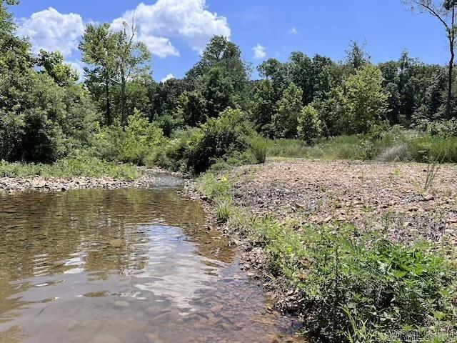 Looking for a property? This mostly cleared property with 4 and 5 barbed wire fence is great for hunting with 2 tree stands, great for livestock or hay fields with a beautiful creek for swimming or watering livestock. Looking for a place to build a new house with great views? This is the property for you.