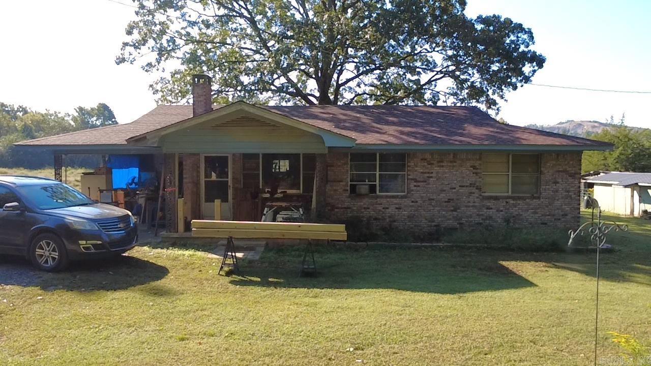 Discover this 1900 sq foot work in progress, three-bedroom, two-bath home nestled on scenic rolling acres near the stunning Ouachita National Forest. Enjoy breathtaking mountain views, mature hardwood trees, and abundant wildlife. The property features a spring-fed pond and year-round creek, perfect for outdoor activities and relaxation. The home boasts original hardwood floors in some rooms and has renovations and upgrades underway , offering you the opportunity to add your personal touch. Fully fenced for privacy and or livestock, this peaceful retreat is also Wolf Pen Gap ATV accessible and just minutes from Mena. A perfect blend of nature, tranquility, and potentialāschedule your showing today!