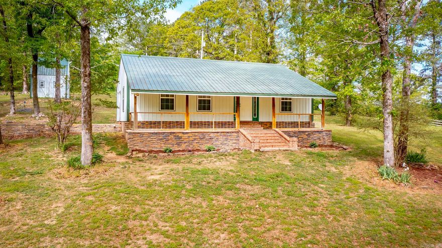 Charming 2 bed, 2 bath home on 2.2 beautiful acres with the perfect mix of space and functionality! Inside, you’ll love the oversized living room featuring stunning custom wood walls and a warm, inviting feel. The open kitchen offers an abundance of custom wood cabinetry, tons of pantry storage, a breakfast bar, and a spacious dining area—perfect for everyday living or entertaining. The primary suite includes a custom tile shower and direct access to the outdoors, adding a private retreat feel. Outside, the property is set up for country living with a workshop with electricity, a fenced area ready for horses, and plenty of room to roam. Bonus: a slab has already been poured with plumbing in place, making it easy to add a new primary suite or expand the home. Don’t miss this one!