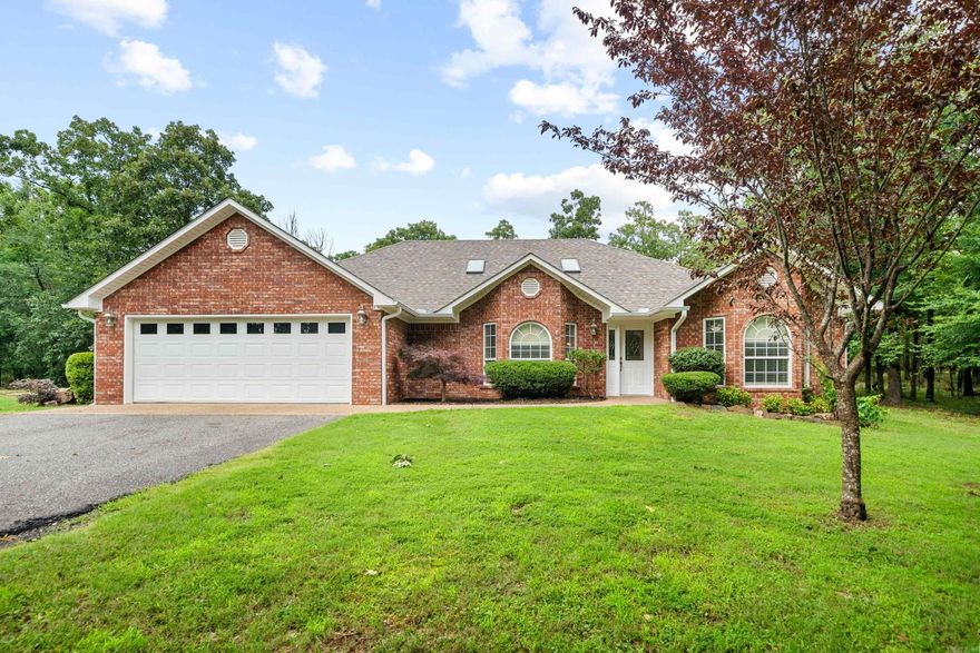 A rare find, convenient location in the city with 3.8 acres of wooded land.  The house has a set back, and elevated location surrounded by beautiful hardwoods.  Living in the city with peacefulness of being away from it all.   This well cared for home has been updated and is move in ready. Rare to find 3.8 acres in the city, the possibilities are endless.  The back of the property also has Lakeshore frontage if you wanted to develop homesites.  A new roof and new appliances are a few of the recent updates to the home.