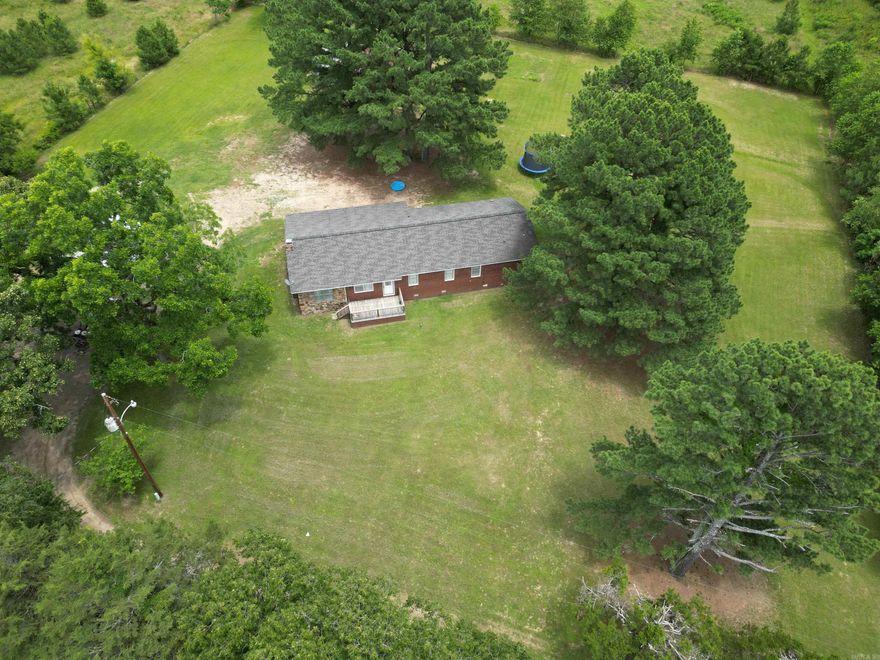 3 bedroom, 2 bath home on 6 private acres with tree lined boundaries. The home has 2 large bedrooms and one smaller one. Both of the bathrooms are big. When sitting on the back porch, you'd never know you are only 15 minutes from Russellville and I-40. It has public water, but there is a well present as well. Offers pasture, room for a garden, a two car carport and a huge pecan tree. If you are looking for a homestead, this could be the one.