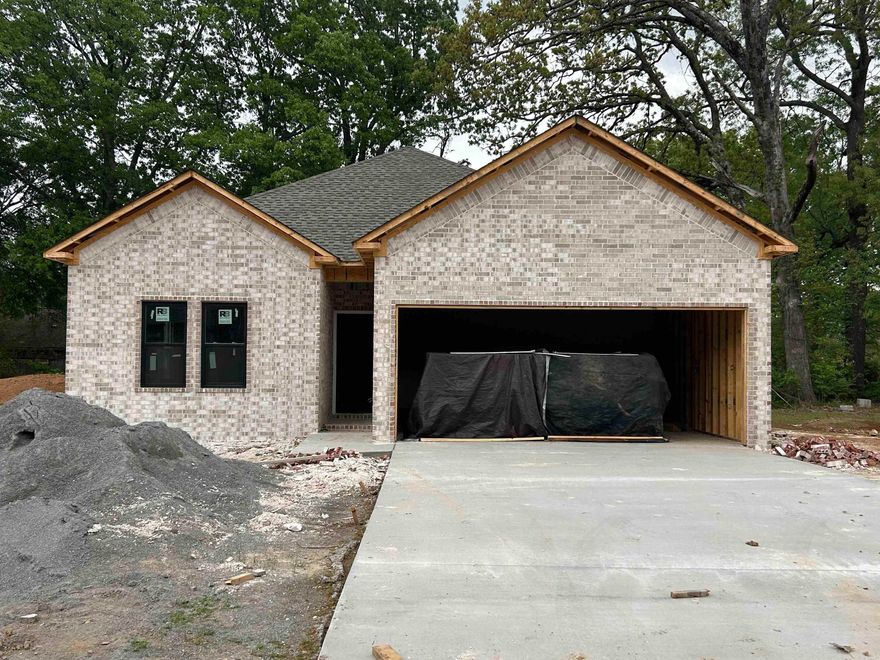 Lonoke is getting some wonderful new additions to this beautiful neighborhood! Super convenient access to I-40 makes this a tucked-away gem! All-brick exterior opens to an open concept living space! You will find all these rooms "just right" in size, including the high trey ceilings in living room and primary bedroom! Floorplan and more photos are coming soon!