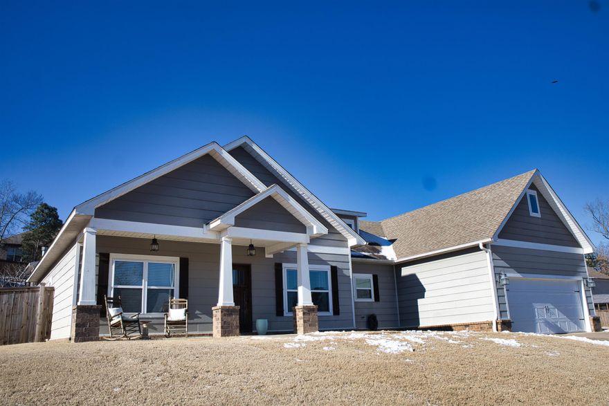 Step into comfort and style with this 3 bedroom, 2 bath one level home nestled in the gated neighborhood of Lochridge Estates. This craftsman inspired gem is located right across from the neighborhood lake, perfect for fishing adventures. The kitchen is great for a home chef and is equipped with a gas range, a wine fridge, an abundance of storage, and stylish subway tile. While the open layout is ideal for gatherings, the split floor plan is perfect for privacy. The primary suite is a cozy retreat, with extra space for exercise equipment, desk, or crib. The ensuite includes a bright, spa-like bath and the large closet is conveniently located with access to the laundry room. The backyard has been recently fenced and is perfect for outdoor entertainment. Schedule a showing today and make this beautiful home yours!