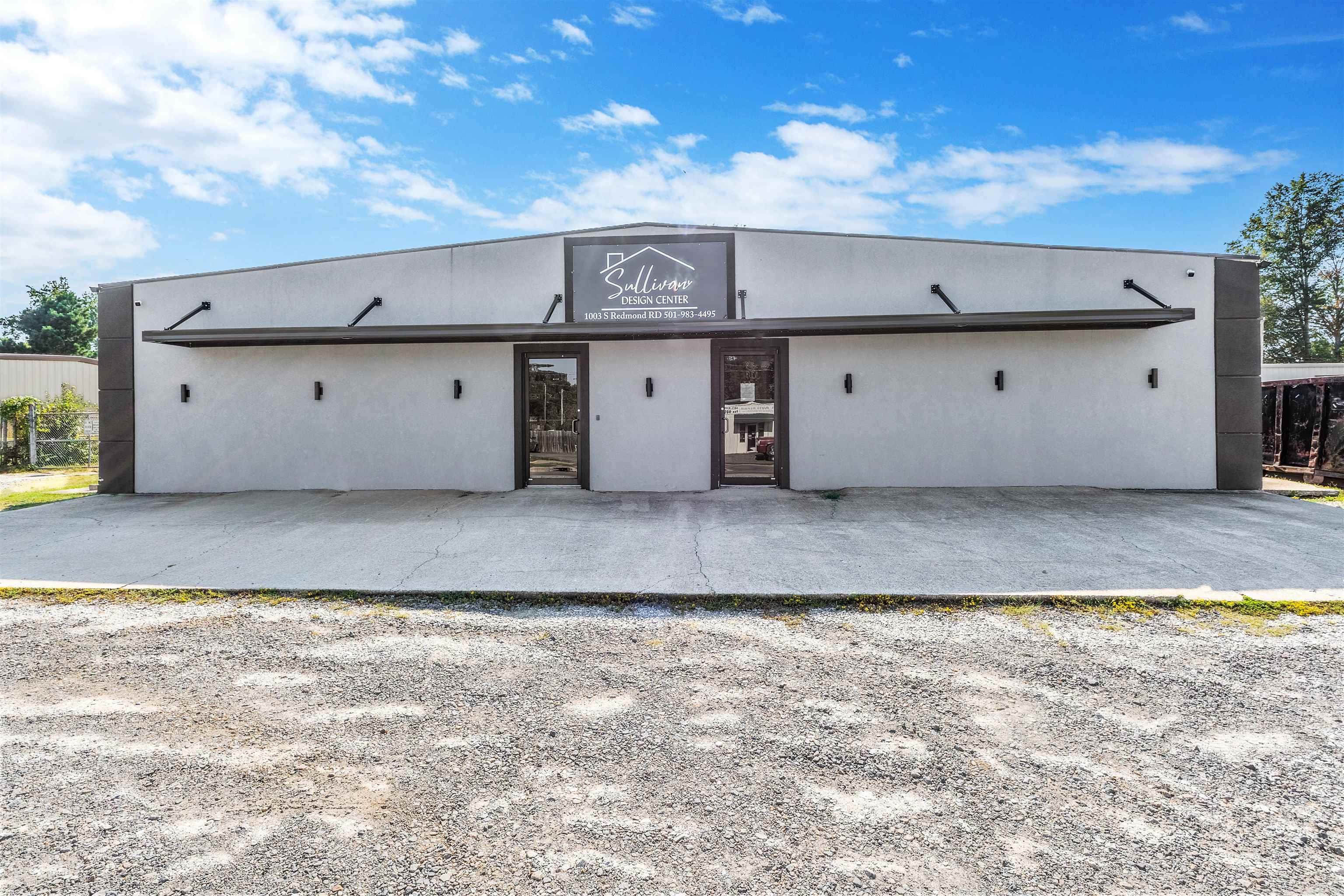 This versatile commercial property offers an ideal blend of showroom, office, and warehouse space to accommodate a wide range of business operations. The front 3,000 square feet feature a modern, climate-controlled showroom and office area, including three private offices, a central conference room, and two restrooms. The rear section provides generous warehouse space (5,100 SF) with three grade-level doors for easy access and loading. New HVAC in 2023! Outside, a fully fenced yard offers secure additional storage or parking. Functional, flexible, and well-maintained, this property is ready to support your business growth.