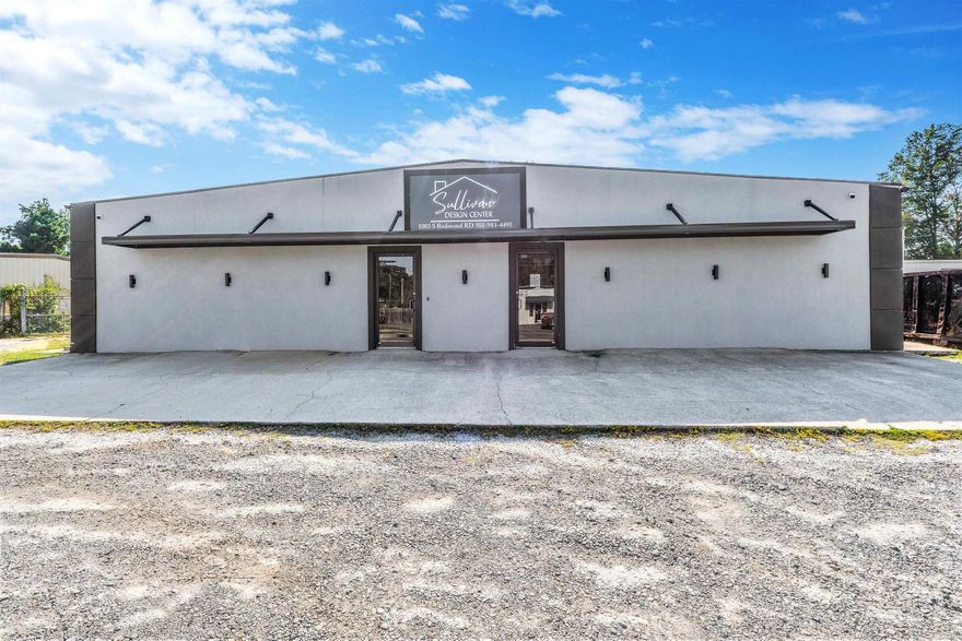 This versatile commercial property offers an ideal blend of showroom, office, and warehouse space to accommodate a wide range of business operations. The front 3,000 square feet feature a modern, climate-controlled showroom and office area, including three private offices, a central conference room, and two restrooms. The rear section provides generous warehouse space (5,100 SF) with three grade-level doors for easy access and loading. New HVAC in 2023! Outside, a fully fenced yard offers secure additional storage or parking. Functional, flexible, and well-maintained, this property is ready to support your business growth.