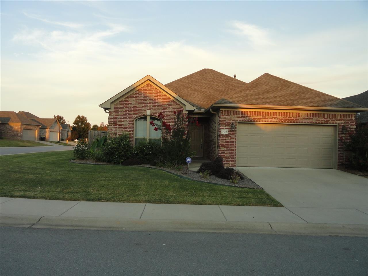 Wonderful home in The Oaks at Heritage Farm. 3 bedroom 2 bath open floor plan, low maintenance home. Front and side yard are maintained by the POA. Very spacious great room with gas log fireplace. Granite tile and tumbled marble backsplash in the kitchen. Master Suite area has large bath with spa tub and master closet. All laminate and tile flooring!!!! Back yard is very low maintenance with beautiful plants.
