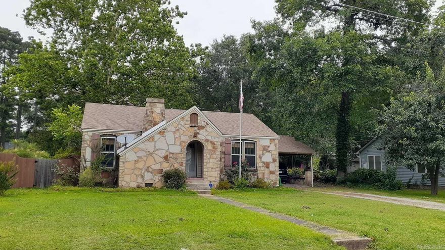 so much character in this beautiful property that was constructed in 1950. new deck that overlooks the tree shaded lot with 2 storage buildings