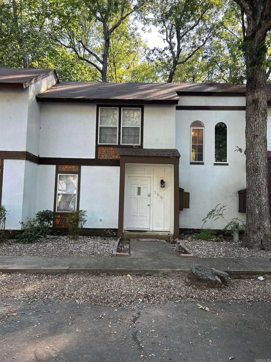 Two bedroom, one and a half bathroom townhome located in the gated Hot Springs Village.  The DeSoto Court Townhomes are right next to DeSoto Golf Course.  Roof is one year old.  HVAC is one year old.  Comes with refrigerator, washer and dryer. There is also a window unit in second bedroom.  Hot Springs Village offers 19 hole golf courses, several lakes, hiking trails, tennis courts, fitness center and so much more!