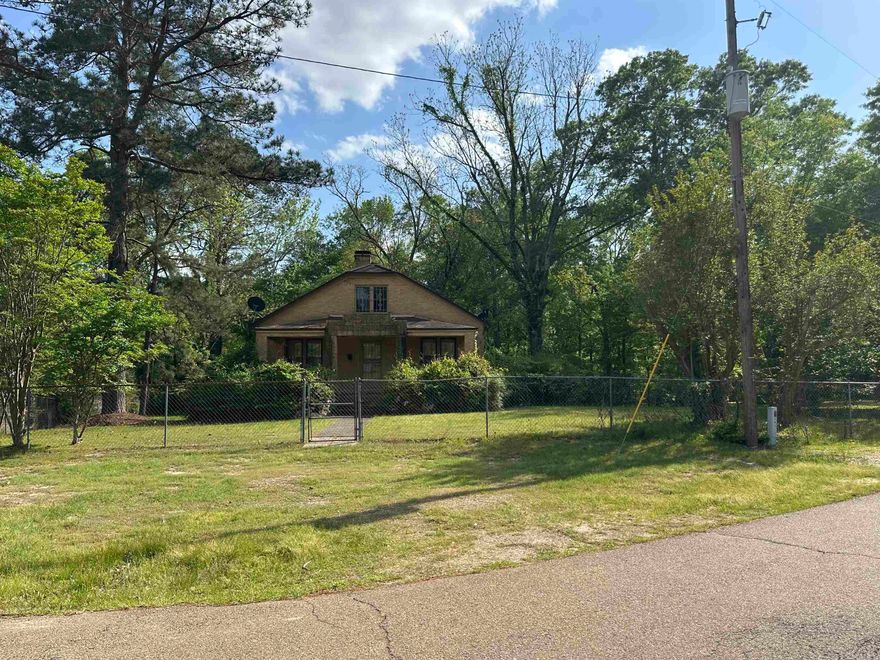 This house is just located just a block from downtown Smackover, larger lot, lots of potential.