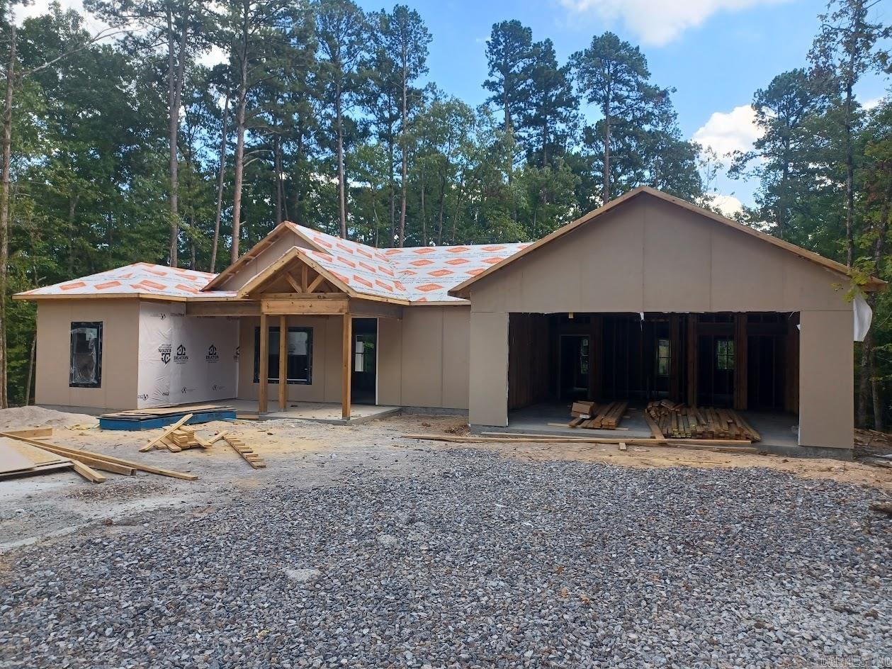 The popular Magnolia plan has all the features you are looking for. An open floor plan with a generous kitchen and large farm style island. Custom tile work in your bathrooms, all custom built maple cabinets and modern fixtures and hardware. Split bedrooms for privacy, lots of windows and a nice covered patio to enjoy your beautiful wooded surroundings. No wasted space in this home. Most affordable new construction in the area. Still time to choose your flooring, counters and interior paint. Be in your new home before the end of the year!