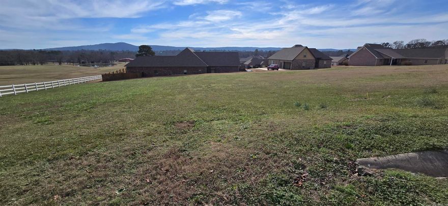 Beautiful .45 acre lot on the back side of West Winds Subdivision.  Situated at the end of the road, the expansive mountain and pasture views offer an unexpected peaceful tranquility to build your dream home in this upscale gated neighborhood. Community boat launch, tie up dock, and gazebo for easy access to Lake Hamilton. A short 15 minutes or less to Lake Hamilton Schools, Hot Springs, and Oaklawn Park.   All underground utilities available at the street.  Make this lovely property the foundation for all your dreams to come true!
