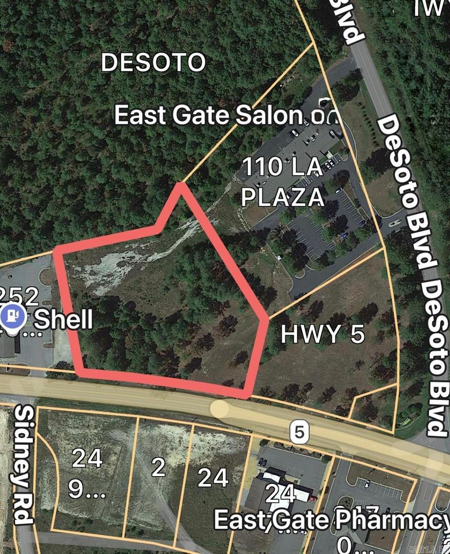 EXCEPTIONAL COMMERCIAL INVESTMENT OPPORTUNITY near the East Gate of Hot Springs Village! This highly visible parcel is positioned in a high-traffic corridor beside a busy gas station and across from established commercial development, offering strong daily exposure. Located just outside the largest gated community in the U.S., this site draws consistent demand from residents, contractors, and visitors entering the Village year-round. Ideal for multiple uses such as a car wash, bakery, retail shop, coffee shop, boutique restaurant, medical or professional offices, or other service-based businesses. The east side of Hot Springs Village continues to grow with new homes, expanding amenities, and increasing tourism. With more than 15,000 residents and thousands of weekly guests coming for golf, lakes, trails, and short-term rentals, this location provides excellent visibility and long-term investment potential. A rare chance to secure commercial space in a thriving and fast-growing market.