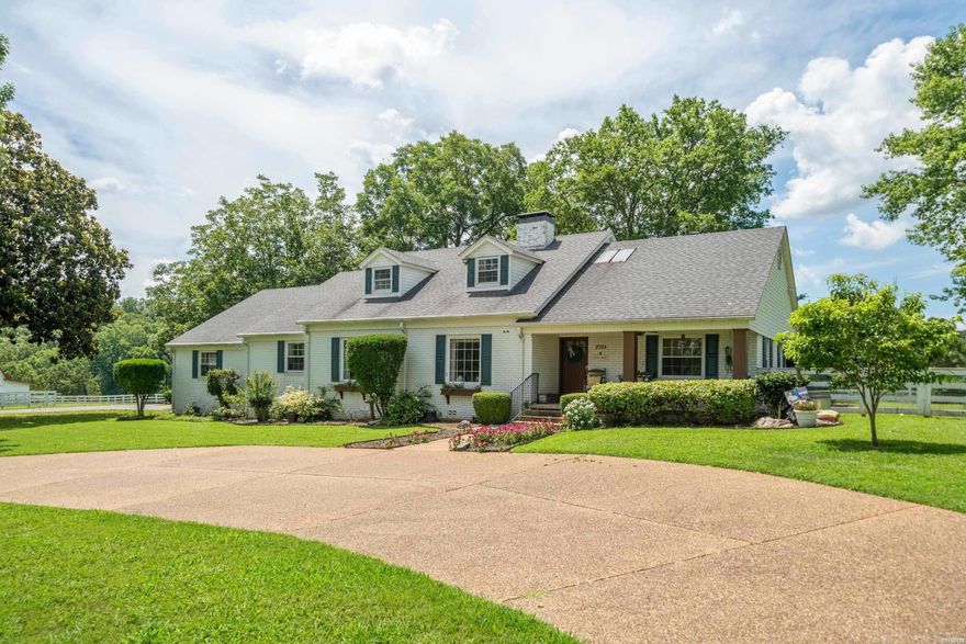 A true hidden gem—this sprawling 25-acre (+/-) farm is nestled right in the middle of Hot Springs, just half a mile from Lakeside School and 2.5 miles from Oaklawn Racetrack, offering both seclusion and unbeatable convenience. At the end of a long private paved driveway sits a charming 4-bedroom, 2-bath farmhouse, perfectly perched on a hill with sweeping views of the surrounding pastures. The upstairs bonus room currently serves as a 5th bedroom. The land is fenced and ideal for an equestrian facility, with lush grazing areas and a well-maintained barn complete with stables and an equipment room. The former guest cottage on the property needs full renovation and is currently being used as a storage area. With its rare combination of size, location, and utility, this one-of-a-kind farm is perfect for those seeking space, privacy, and endless potential. Note: The 2.7 acres (+/-) of property fronting Malvern Avenue is commercially zoned and not included with this listing; however, it may be purchased separately.