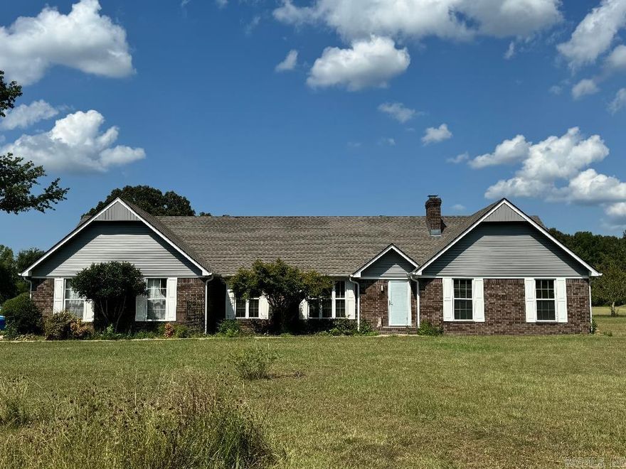 Wonderful updated home on 10+ acres_new roof, new siding, new kitchen countertops, new tile & ceiling fixtures in rooms and dining along w/ the majority of the house freshly painted.  There is a separate shop with a concrete slab floor to be used as a workshop, additional vehicle storage, etc. Enjoy the fireplace in the open floor plan living area/kitchen.  Additional acreage allows you to bring your larger furry friends or land can be subdivided to build another home. Sold As-Is.