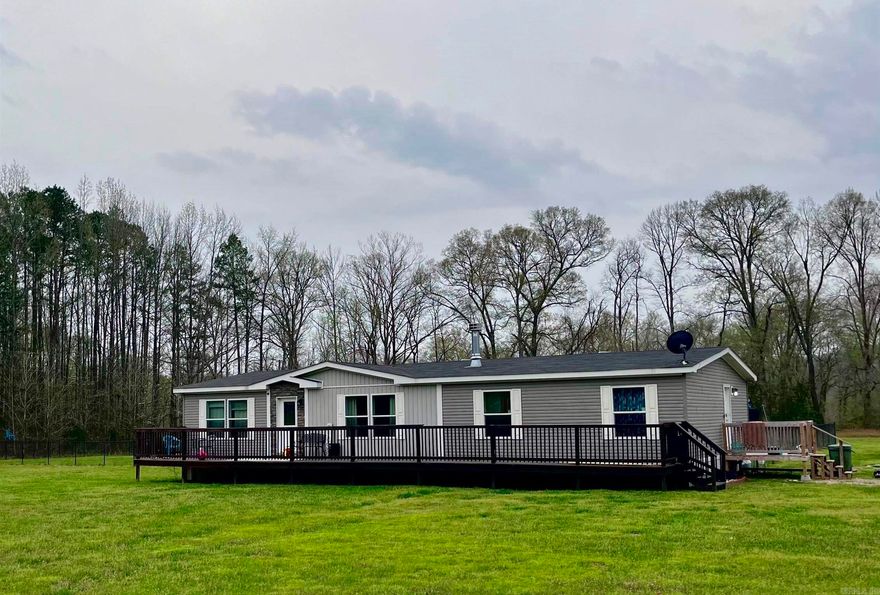 This beautiful 3 bed/2 bath country home in Fountain Lake School District is the perfect place to call home. Open & airy floor plan boasts a spacious kitchen w/tons of storage & cabinet space. Gorgeous primary suite with walk-in-closet & beautifully tiled walk-in-shower. So many updates throughout including new luxury vinyl plank flooring & new water filtration system & built in air purifier. Completely fenced in backyard that is perfect for family entertaining.