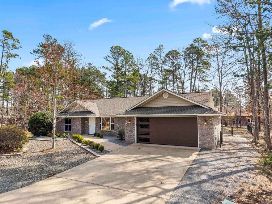 This charming, three bedroom, two bath home centrally located in  beautiful Hot Springs Village has been completely re-vamped! New luxury vinyl plank flooring greets you in this spacious open floor plan! New quartz countertops, new faucets, GE appliances, and a farmhouse sink make cooking a joy! New lighting fixtures, ceiling fans, and Levelor mini-blinds provide tranquil ambiance! The 2 car oversized garage houses a NEW insulated HAAS garage door and NEW Liftmaster garage door opener. NEW updates in the primary bath including a NEW glass shower door and faucet, add to the relaxing feel.  Entertain guests or looking for a cozy place to enjoy nature and play with Fido? Don’t miss the back patio and NEW fenced yard!  Call me to schedule your showing!